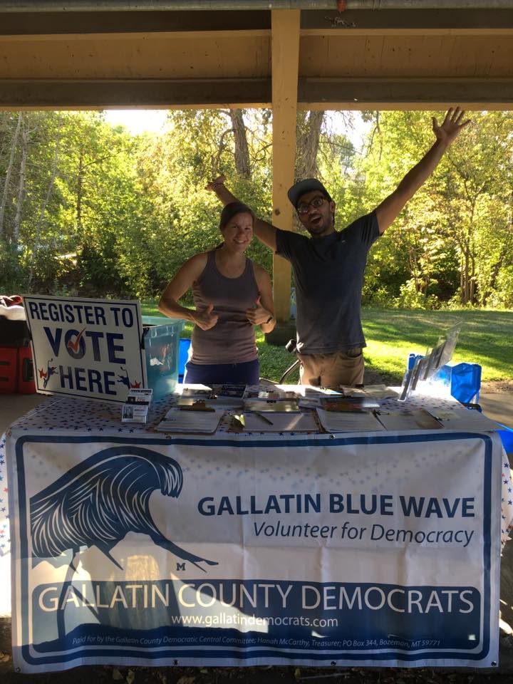 Two volunteers at booth at the Bogert Farmers Market