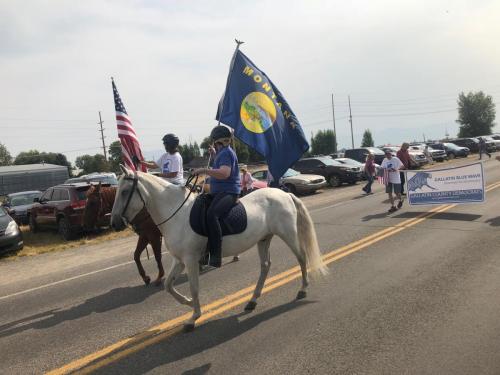 Our flags led the way on horseback!